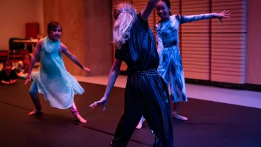 Three girls dancing.